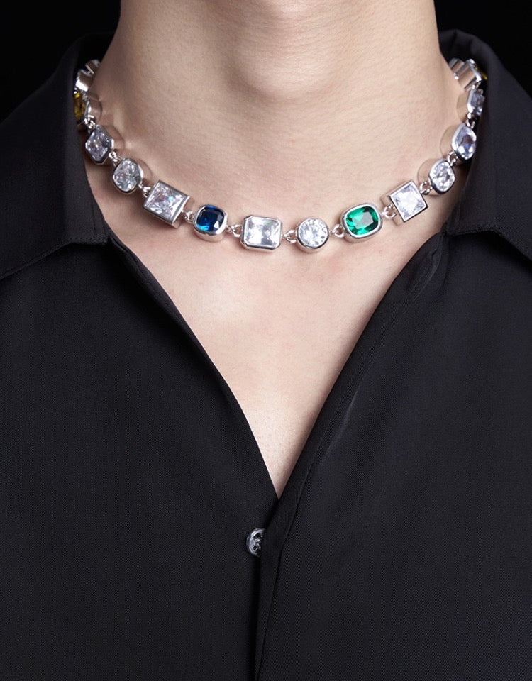 Pharrell Williams grills are studded with sapphires, rubies and emeralds. INFINITY GAUNTLETS jewelry diamond choker jacob & co short necklace gemstone heart Gabby Elan Jewelry infinity stone grillz grill grills