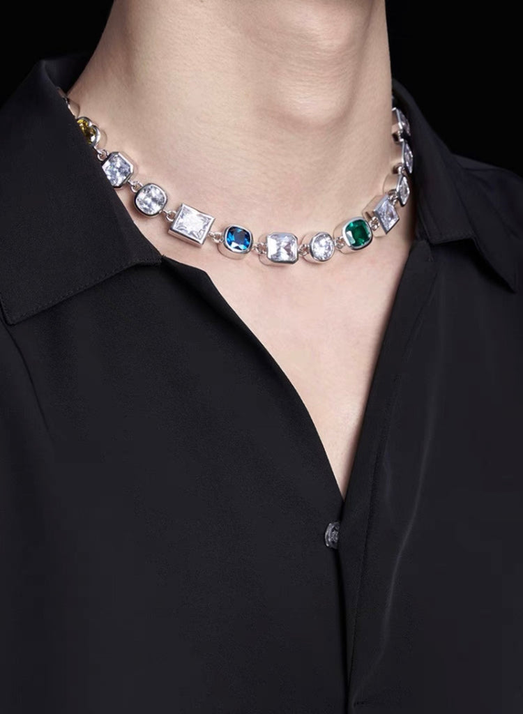 Pharrell Williams grills are studded with sapphires, rubies and emeralds. INFINITY GAUNTLETS jewelry diamond choker jacob & co short necklace gemstone heart Gabby Elan Jewelry infinity stone grillz grill grills