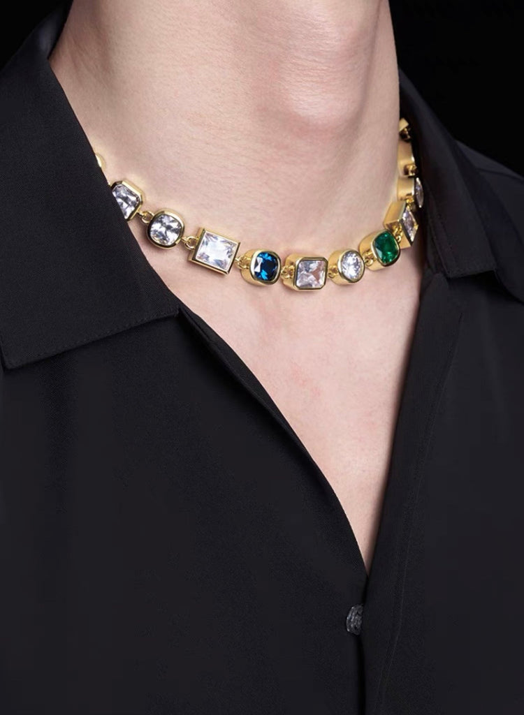 Pharrell Williams grills are studded with sapphires, rubies and emeralds. INFINITY GAUNTLETS jewelry diamond choker jacob & co short necklace gemstone heart Gabby Elan Jewelry infinity stone grillz grill grills