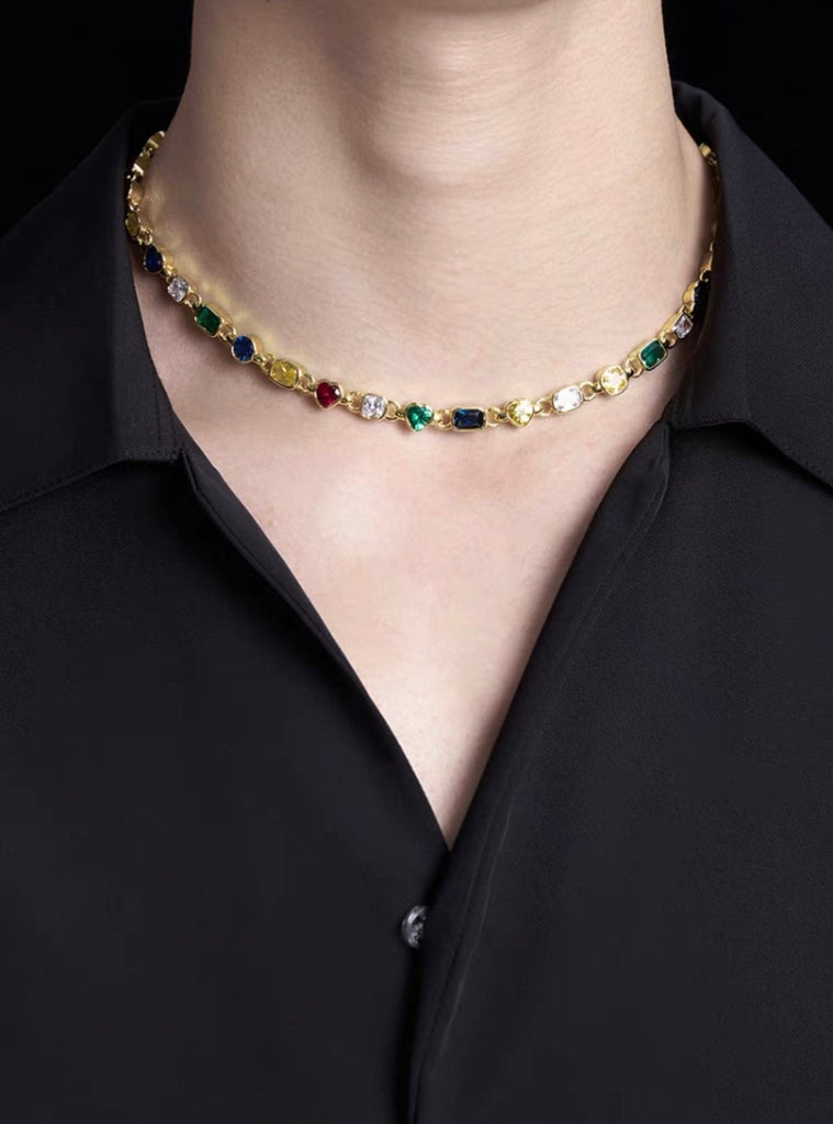 Pharrell Williams grills are studded with sapphires, rubies and emeralds. INFINITY GAUNTLETS jewelry diamond choker jacob & co short necklace gemstone heart Gabby Elan Jewelry infinity stone grillz grill grills