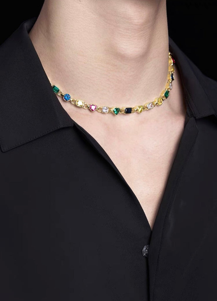 Pharrell Williams grills are studded with sapphires, rubies and emeralds. INFINITY GAUNTLETS jewelry diamond choker jacob & co short necklace gemstone heart Gabby Elan Jewelry infinity stone grillz grill grills