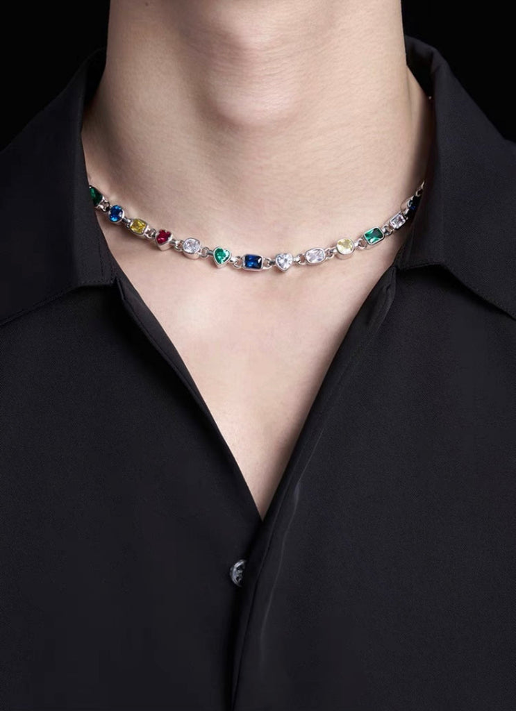 Pharrell Williams grills are studded with sapphires, rubies and emeralds. INFINITY GAUNTLETS jewelry diamond choker jacob & co short necklace gemstone heart Gabby Elan Jewelry infinity stone grillz grill grills