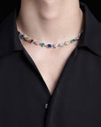 Pharrell Williams grills are studded with sapphires, rubies and emeralds. INFINITY GAUNTLETS jewelry diamond choker jacob & co short necklace gemstone heart Gabby Elan Jewelry infinity stone grillz grill grills