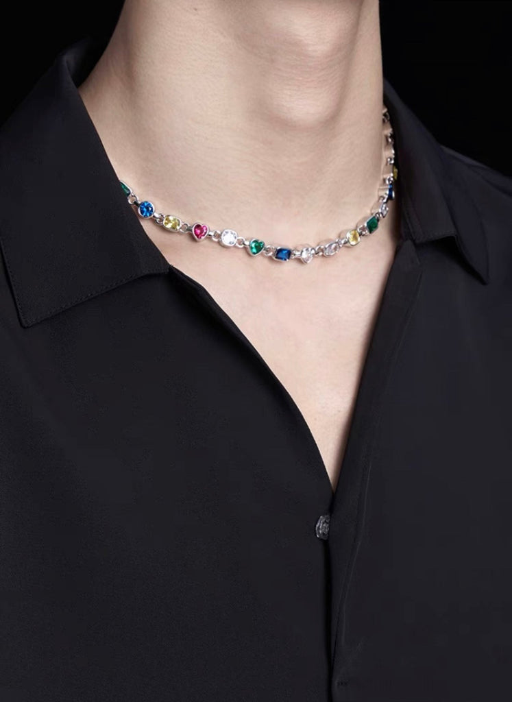 Pharrell Williams grills are studded with sapphires, rubies and emeralds. INFINITY GAUNTLETS jewelry diamond choker jacob & co short necklace gemstone heart Gabby Elan Jewelry infinity stone grillz grill grills