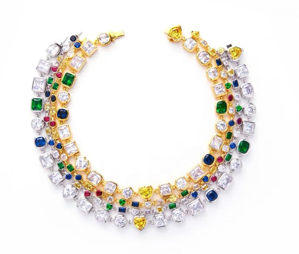 Pharrell Williams grills are studded with sapphires, rubies and emeralds. INFINITY GAUNTLETS jewelry diamond choker jacob & co short necklace gemstone heart Gabby Elan Jewelry infinity stone grillz grill grills