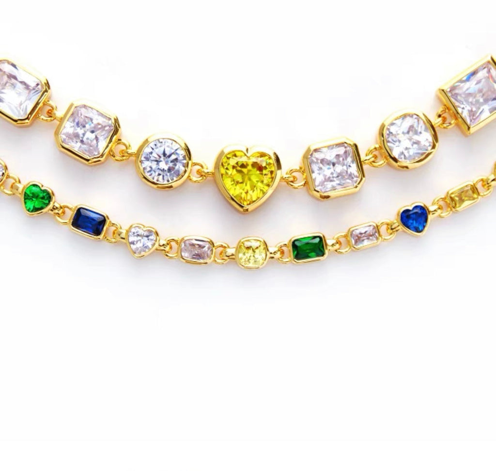 Pharrell Williams grills are studded with sapphires, rubies and emeralds. INFINITY GAUNTLETS jewelry diamond choker jacob & co short necklace gemstone heart Gabby Elan Jewelry infinity stone grillz grill grills