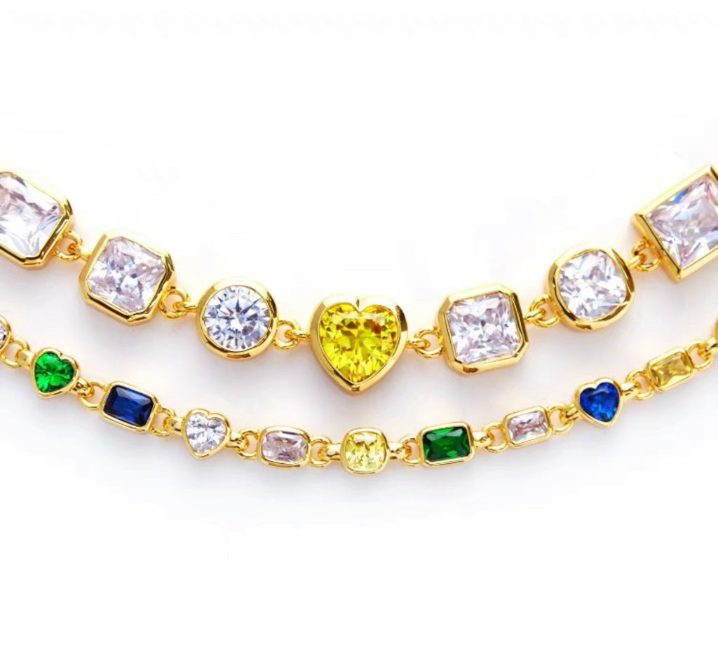 Pharrell Williams grills are studded with sapphires, rubies and emeralds. INFINITY GAUNTLETS jewelry diamond choker jacob & co short necklace gemstone heart Gabby Elan Jewelry infinity stone grillz grill grills