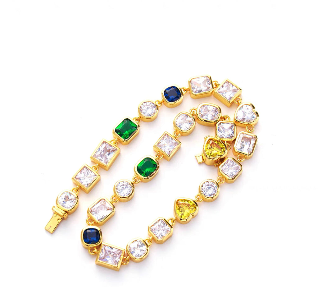 Pharrell Williams grills are studded with sapphires, rubies and emeralds. INFINITY GAUNTLETS jewelry diamond choker jacob & co short necklace gemstone heart Gabby Elan Jewelry infinity stone grillz grill grills