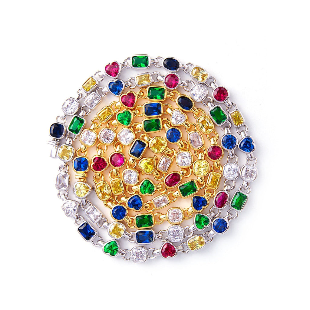 Pharrell Williams grills are studded with sapphires, rubies and emeralds. INFINITY GAUNTLETS jewelry diamond choker jacob & co short necklace gemstone heart Gabby Elan Jewelry infinity stone grillz grill grills