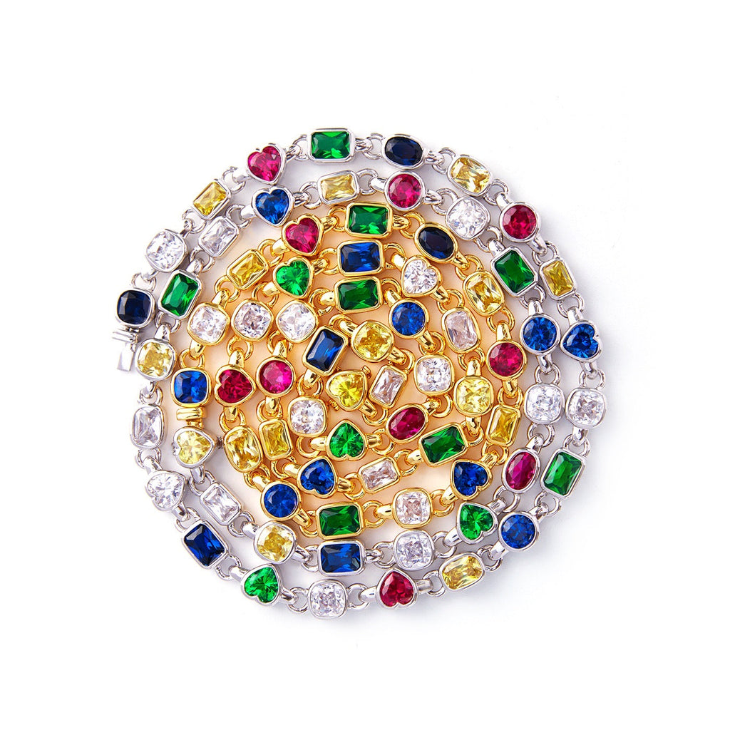 Pharrell Williams grills are studded with sapphires, rubies and emeralds. INFINITY GAUNTLETS jewelry diamond choker jacob & co short necklace gemstone heart Gabby Elan Jewelry infinity stone grillz grill grills