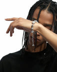 Travis Scott recently got pretty generous with his team, gifting his inner circle iced-out Takashi Murakami-designed chains from Eliantte