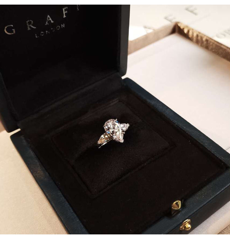asap rocky pear diamond ring unique three stone engagement ring jeweler vvs 