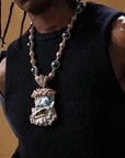 Travis Scott recently got pretty generous with his team, gifting his inner circle iced-out Takashi Murakami-designed chains from Eliantte