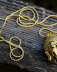 buddha head half face pendant gold